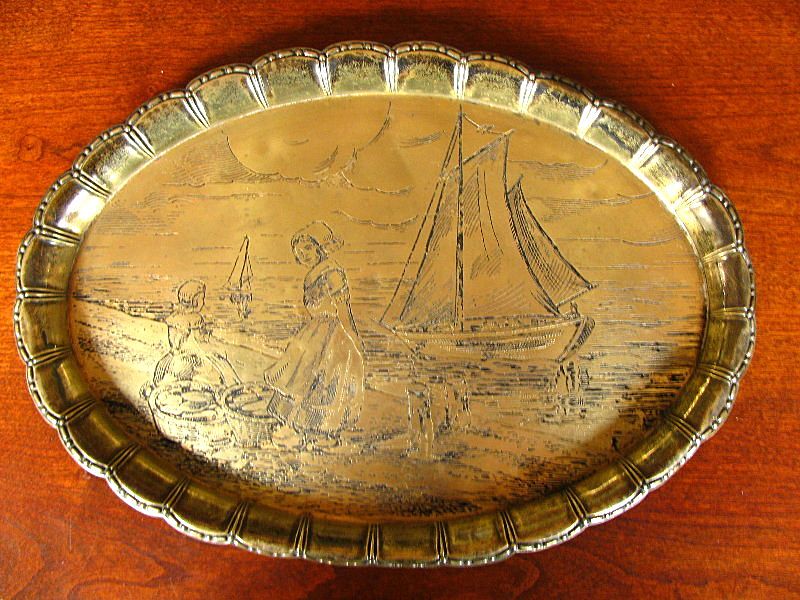 An engraved antique brass tray.
